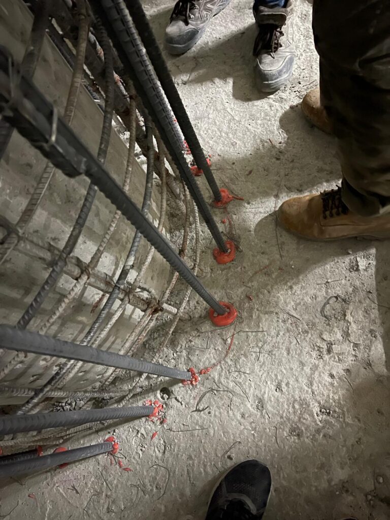 Anchoring rebar to the bottom slab using Hilti epoxy.