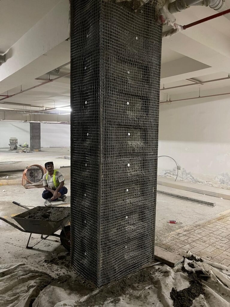 Installing steel mesh to hold plaster in place.